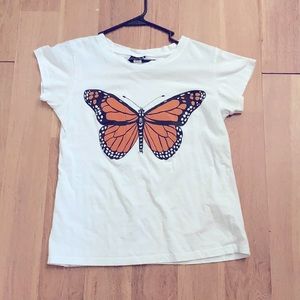 This T-shirt is a butterfly popular sport orange and white medium to large